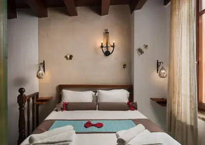 a bedroom with a bed with two towels on it at Dream Art Studios in Chania Town