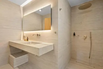 a bathroom with a sink and a mirror at Sea Princessa Villa in Chania Town