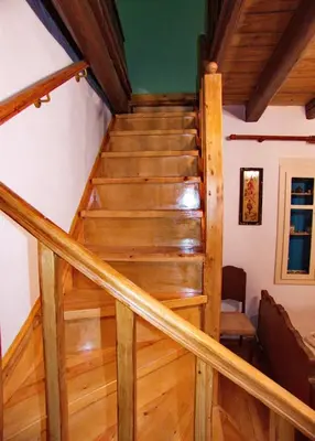 a staircase in a house with wooden floors at Polidoros vintage house 13 km from Elafonisi in Vathi