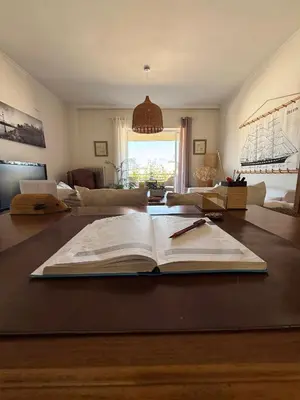an open book on a table in a living room at Chania Memories Apartment in Chania Town