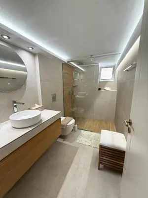 a bathroom with a sink and a toilet at Chania Memories Apartment in Chania Town