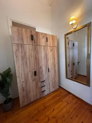 a room with a large wooden door and a mirror at Yellowstone Chania in Chania Town