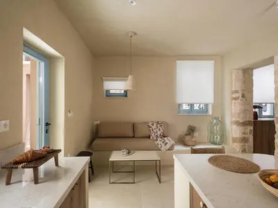 a living room with a couch and a table at Off Apartments in Chania Town