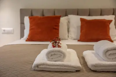 a bedroom with a bed with towels on it at Garden House 2 in Kissamos