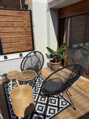 two chairs and a table on a balcony at Stay near Balos & the seaside in Kaloudhianá