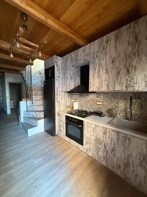 a kitchen with a sink and a stove top oven at Stay near Balos & the seaside in Kaloudhianá