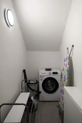 a laundry room with a washing machine in a room at Apanemia Apartment in Chania Town
