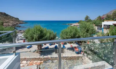 a view of the ocean from a balcony at Phoenix Coastal Heaven in Loutro