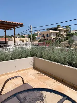 a view from the balcony of a house with a swimming pool at Platanias Memories Studio 3 in Plataniás
