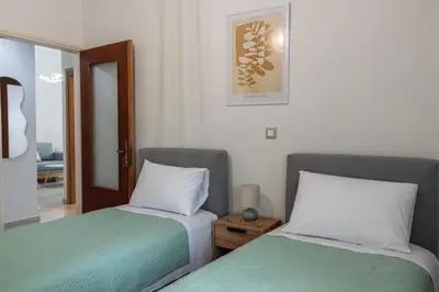 two beds sitting next to each other in a room at Lemon Tree Chania in Chania Town
