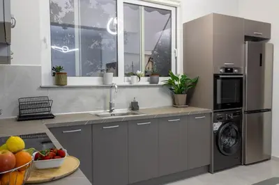 a kitchen with a sink and a dishwasher at Lemon Tree Chania in Chania Town