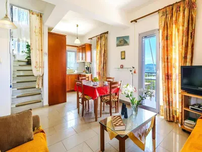 a living room with a couch and a table at Holiday home, Marathokefala near Kolimbari in Marathokefála