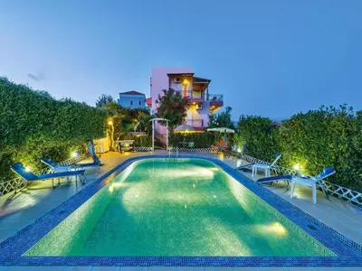 a swimming pool in front of a house at Holiday home, Marathokefala near Kolimbari in Marathokefála