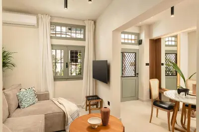 a living room with a couch and a table at Old Town Apt, Balcony, brand new, family, central in Chania Town