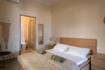 a bedroom with a large bed in a room at andys house in Chania