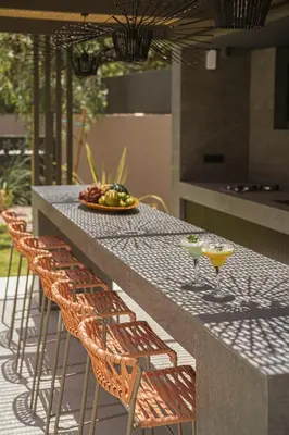 a table with four chairs and two drinks on it at Villa Azahar Serene Luxury Living in Milonianá