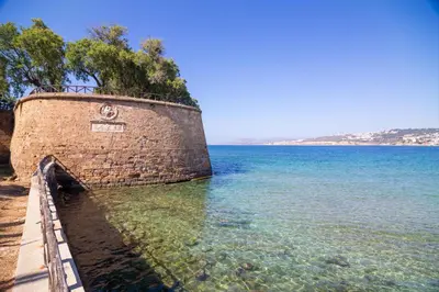 a brick wall in the water next to the ocean at Ariadne de Potie Maisonette in Chania Town