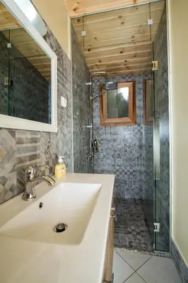 a bathroom with a sink and a shower at Mera Beachfront House - Falasarna in Falasarna