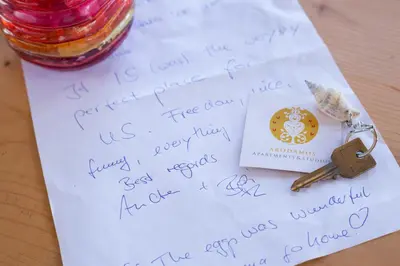 a letter with a key and a jar of jam at Mera Beachfront House - Falasarna in Falasarna