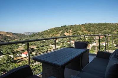 a table and chairs on a balcony with a view at Cozy House Zoi -Top Views, On The Way To Elafonisi in Élos