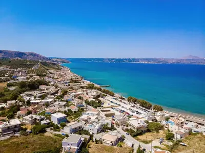 an aerial view of a town next to the ocean at Sunrise Suites & Apartments in Kalyves