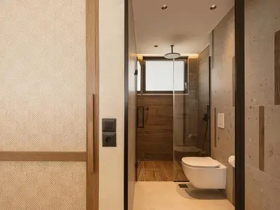a bathroom with a toilet and a window at Onora Villa - Steps from the Sea by etouri in Nopíyia