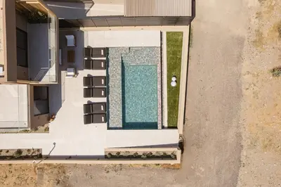 an overhead view of a swimming pool in a house at Onora Villa - Steps from the Sea by etouri in Nopíyia