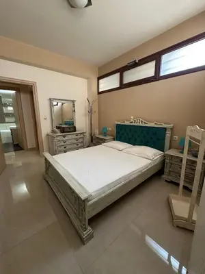 a bedroom with a large bed and a mirror at Casa Emanuel in Chania Town