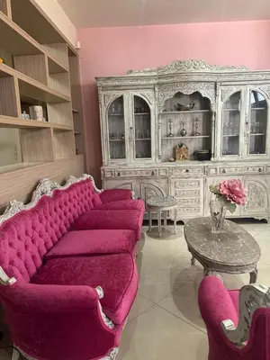 a living room with a purple couch and a table at Casa Emanuel in Chania Town