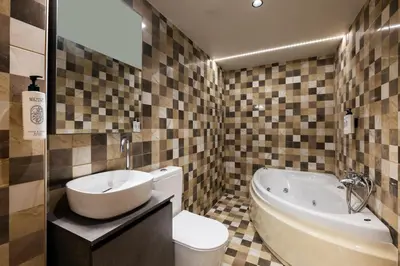 a bathroom with a sink and a tub and a toilet at Madre Tierra Boutique Villa 3 in Potistíria