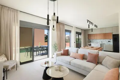 a living room with a couch and a table at Madre Tierra Boutique Villa 3 in Potistíria