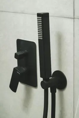 a black wall mounted television on a wall at ES Apartments ARION in Chania Town