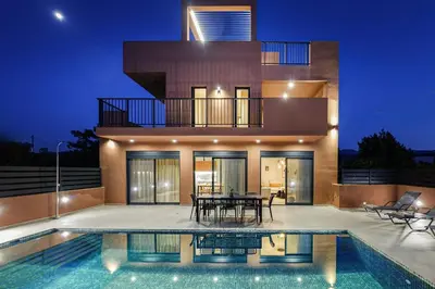 a house with a swimming pool in front of it at Madre Tierra Boutique Villa 4 in Potistíria