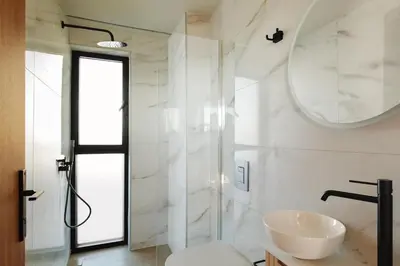 a white bathroom with a sink and a mirror at Madre Tierra Boutique Villa 4 in Potistíria