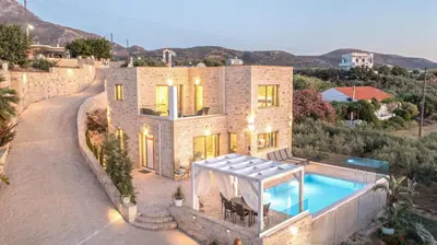 an aerial view of a house with a swimming pool at Koukis Villa With Sea View in Falasarna