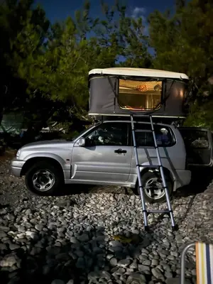 a silver truck with a camper on top of it at Rooftop Jeep Escape Sleep Under the Stars in Chania Town