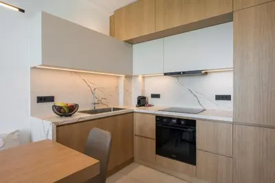 a kitchen with a table and a sink and a stove at Sky Sea View Villas in Chania Town