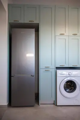 a kitchen with a refrigerator and a washing machine at Villa Akalli in Frangokastello