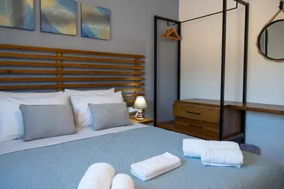 a bedroom with a bed with two towels on it at Villa Akalli in Frangokastello