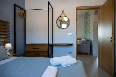 a bedroom with a bed with two towels on it at Villa Akalli in Frangokastello