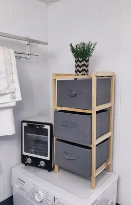 a dresser with a television and a plant on it at Georgia's Dream House in Koprána