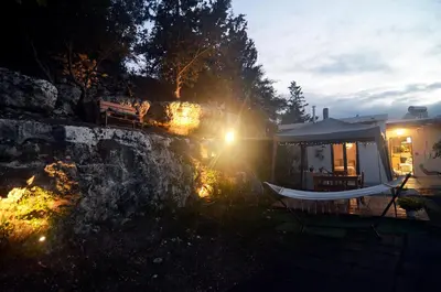 a house with a hammock in front of it at Georgia's Dream House in Koprána