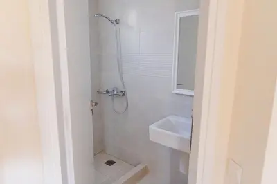 a bathroom with a shower and a sink at Phaedrus Living Seaside Thalassa Cretan 101 in Módhion