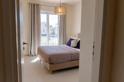 a bedroom with a bed and a large window at Phaedrus Living Seaside Thalassa Cretan 101 in Módhion