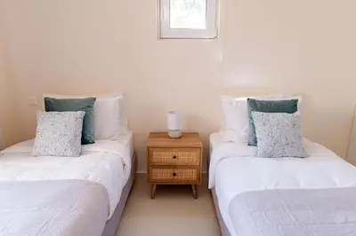 two beds sitting next to each other in a room at Phaedrus Living Seaside Thalassa Cretan 101 in Módhion