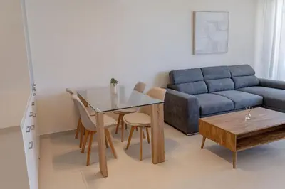 a living room with a couch and a table at Phaedrus Living Seaside Thalassa Cretan D101 in Módhion