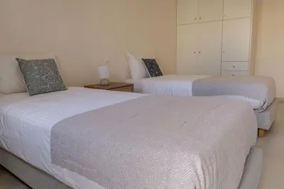 two beds in a room with two beds sidx sidx sidx at Phaedrus Living Seaside Thalassa Cretan D101 in Módhion