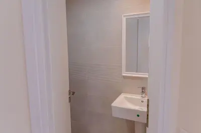 a bathroom with a sink and a mirror at Phaedrus Living Seaside Thalassa Cretan 102 in Módhion