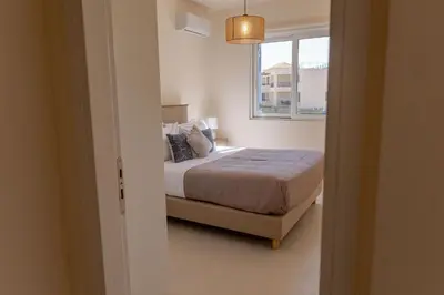 a bedroom with a bed and a window at Phaedrus Living Seaside Thalassa Cretan 103 in Módhion