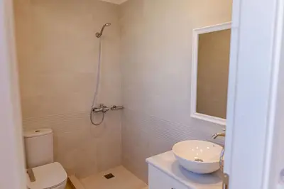 a bathroom with a toilet and a sink and a shower at Phaedrus Living Seaside Thalassa Cretan 201 in Módhion